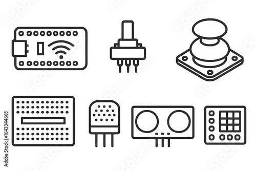 Collection of electronic components including circuit boards and sensors arranged neatly on a flat surface
