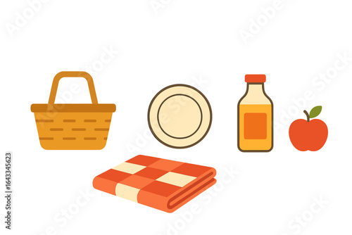 Picnic basket with blanket and food items ready for outdoor fun in a sunny park