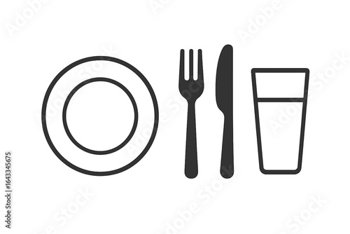 Table setting with plate, cutlery, and glass ready for dining experience during casual lunch time
