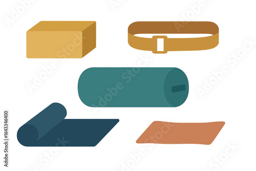 Various yoga props and accessories arranged on a white background for fitness and wellness practice