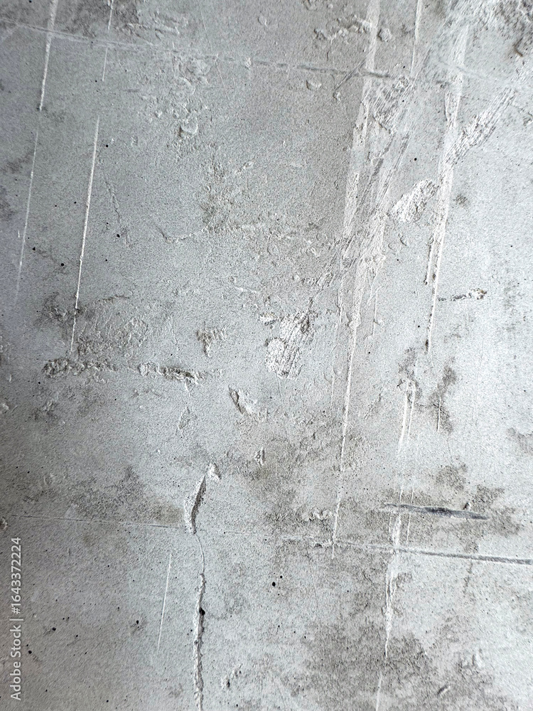 Fototapeta premium Gray cement surface with visible texture, design background, texture or construction visuals