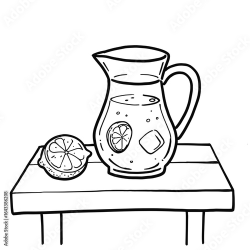 Lemonade pitcher on table with lemon slices and ice cubes  