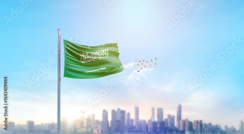 Tableau sur toile Saudi Arabia national flag waving with skyline and buildings