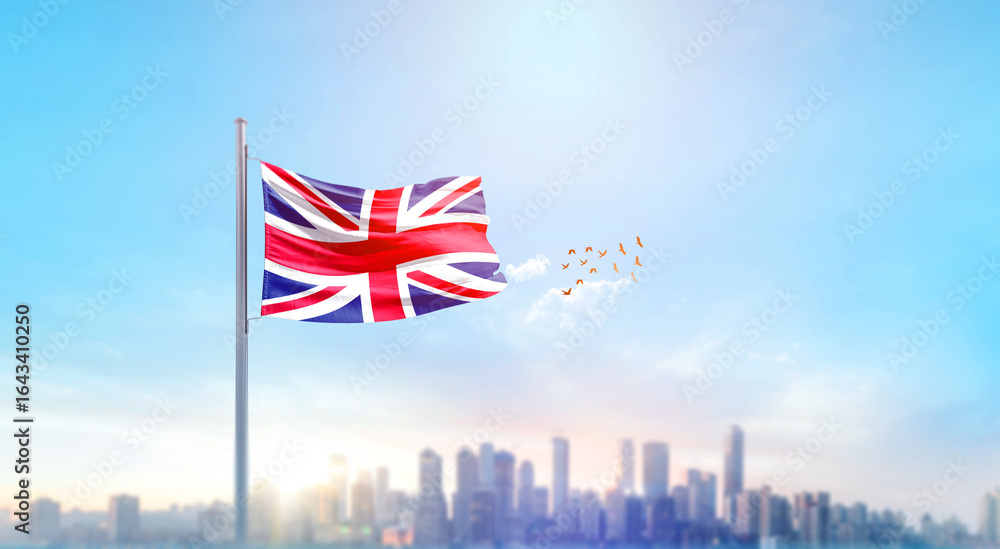 Naklejka premium United Kingdom national flag waving with skyline and buildings. UK national flag for independence day.