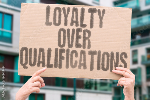 Wallpaper Mural "Loyalty over qualifications" message highlights issues of governance and fairness. POWER. CONTROL. NEPOTISM. BUREAUCRACY. INJUSTICE. INTEGRITY. REFORM. Torontodigital.ca