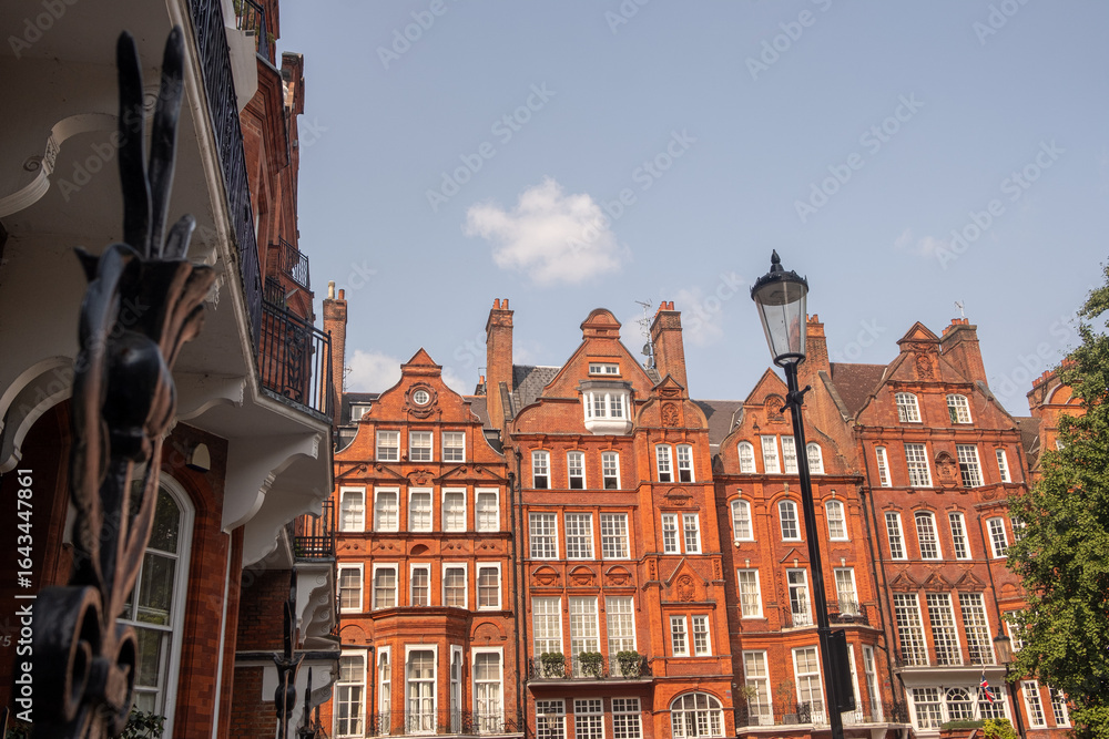Obraz premium Central London property- Red brick mansion buildings in the prestigious neighbourhood around South Kensington Knightsbridge