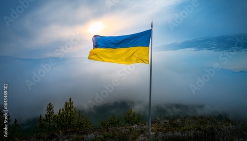 a ukrainian flag waves on a flagpole surrounded by fog and overcast skies the strong winds and thick fog symbolize the steadfast spirit of ukraine especially near the front lines