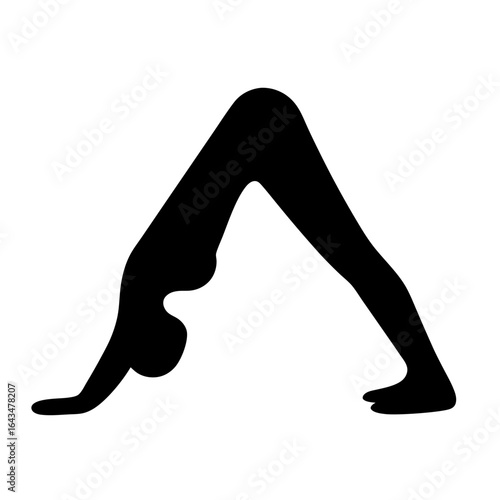 Black silhouette of a person in downwardfacing dog yoga pose