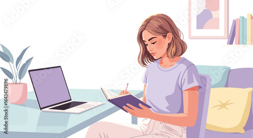 Focused woman studying and writing notes with laptop nearby in cozy room