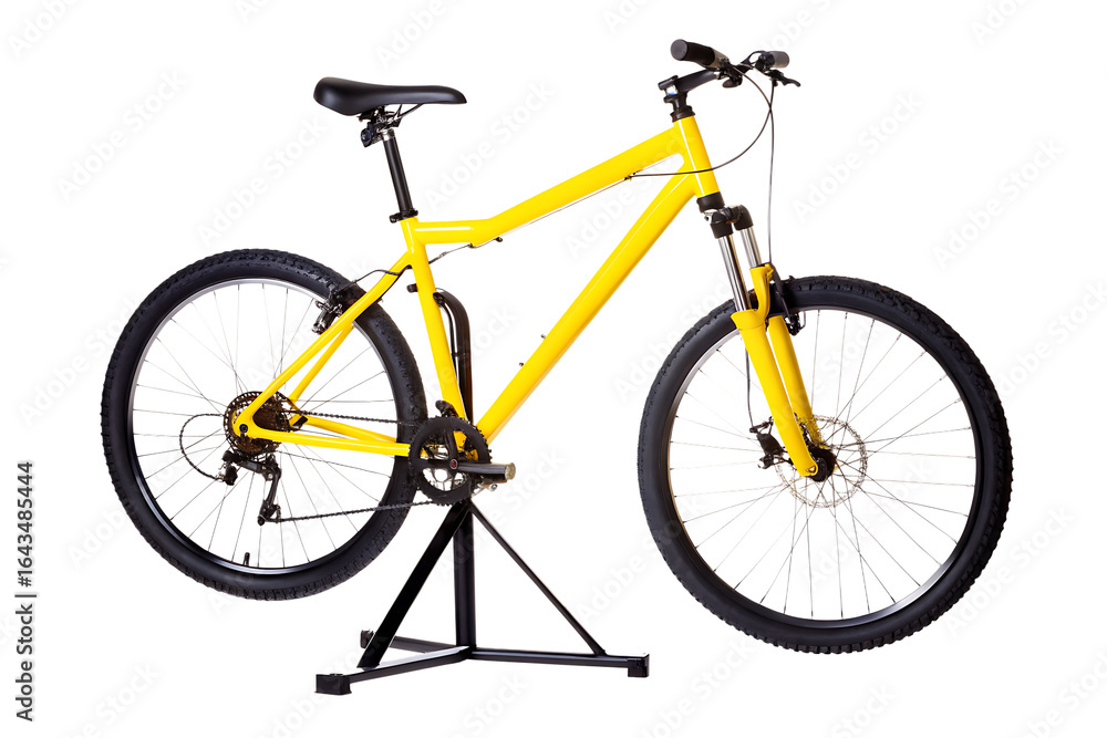 Obraz premium Yellow mountain bicycle on repair stand isolated on a transparent background yellow bicycle