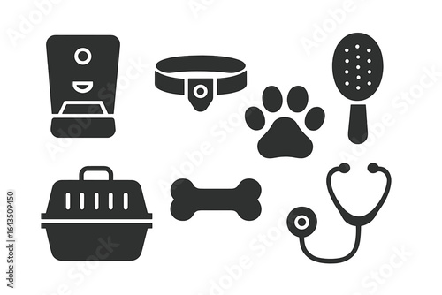 Essential pet care items including food dispenser, collar, grooming brush, and travel carrier laid out on a white background