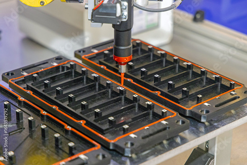 Robot Arm Applying Dispensing Liquid Sealant to Parts in Car Factory