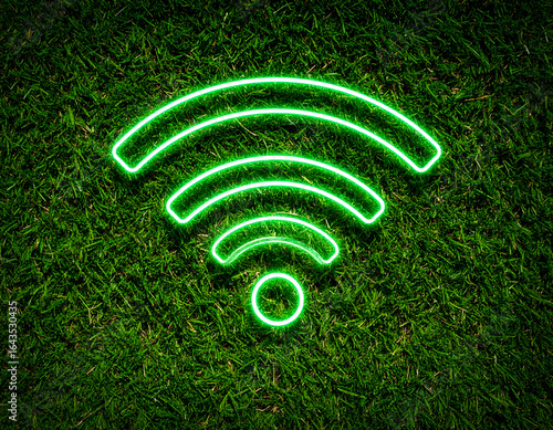Neon green wifi symbol on a grassy surface.