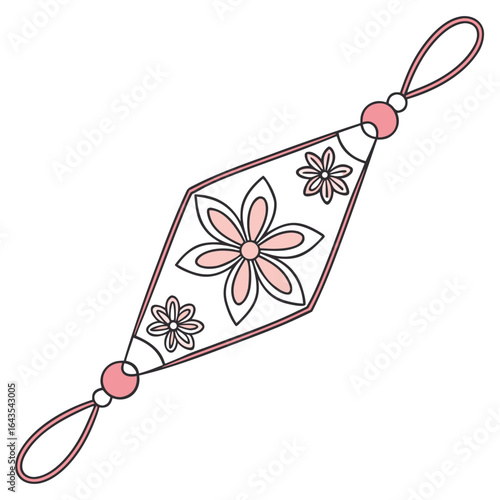 A delicate pink and white floral ornament with a diamond shaped center featuring a loop at each end for hanging symbolizing good luck and beauty