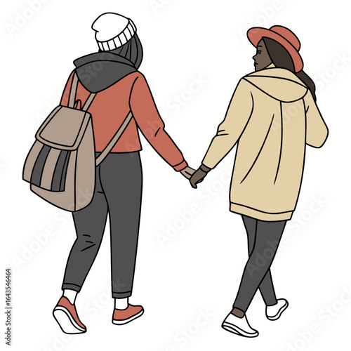 Two young women holding hands while walking together wearing casual winter clothing and backpacks representing friendship and companionship