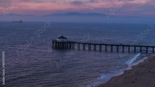 Wallpaper Mural Aerial view of the Manhattan Beach Pier stretching into the tranquil ocean as dusk paints the sky in soft hues, Los Angeles, California, United States. Torontodigital.ca