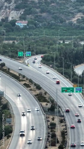 Vertical video of cars on the highway - 4k drone footage of cars driving on the highway