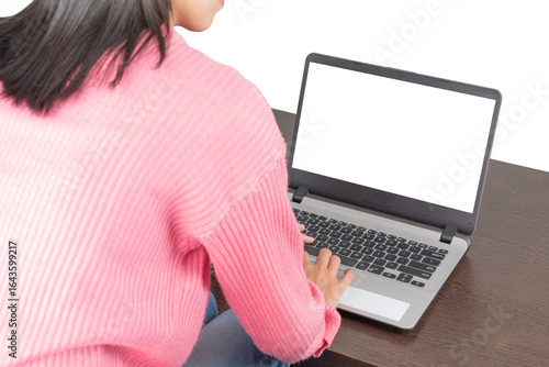 Woman Typing on Laptop at Wooden Table (Isolated)