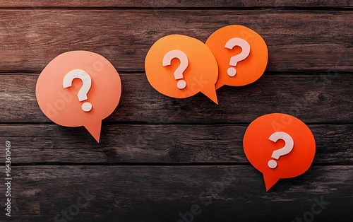 Question Mark Speech Bubbles on Wooden Background