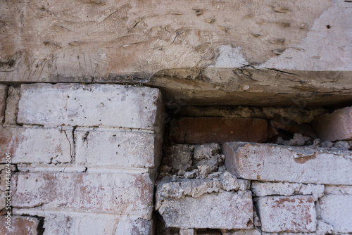 old brick wall with wooden lintel