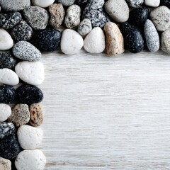 Pebbles arranged in a corner border on a light wood surface