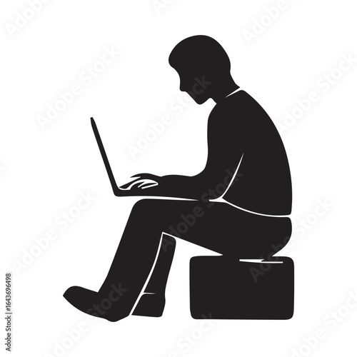 Silhouette of a man sitting and using a laptop isolated on white background