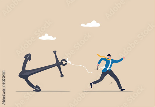 Freedom, relief or escape from bad habit, psychology anchoring effect or cut heavy burden to growing more concept, businessman using scissor to cut the rope tie himself with big heavy anchor.