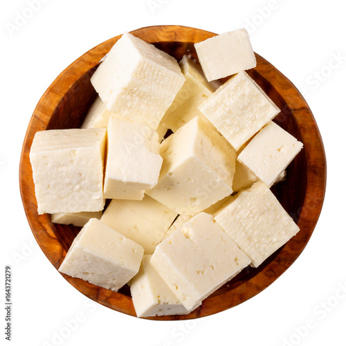 Brynza cheese isolated on white background. Diced soft sheep's cheese bryndza in wooden bowl. Top view.