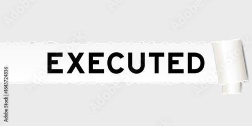 Ripped gray paper background that have word executed under torn part