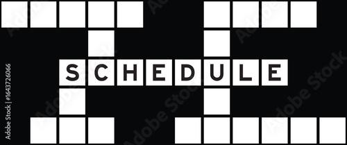 Alphabet letter in word schedule on crossword puzzle background