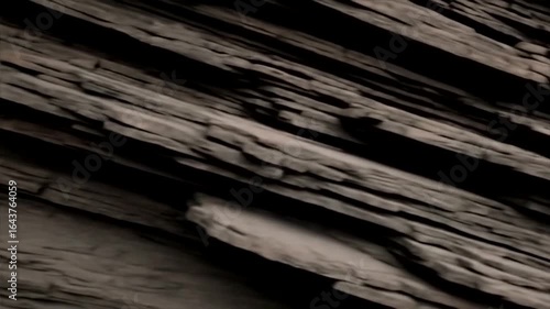 Layered Rock Formation: A Dark, Textured Masterpiece