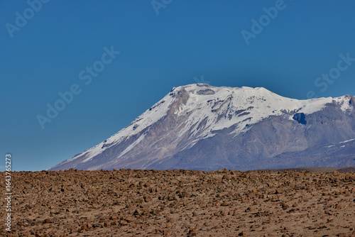 фотографія Majestic and remote, Ampato Volcano rises above the Andean highlands — a silent