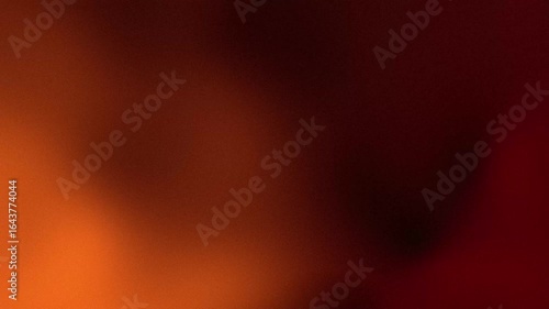 Smooth blurred orange and dark red gradient background with warm tones for abstract artistic visual design