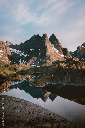 Lake and mountains in Lofoten islands landscape water reflection sunset scenic view in northern Norway travel beautiful destinations, wild nature summer season scenery in Scandinavia