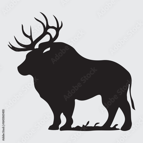 Majestic elk with large antlers standing proudly in profile silhouette
