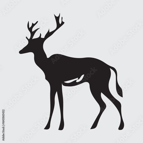 Majestic stag silhouette standing proudly against a light background
