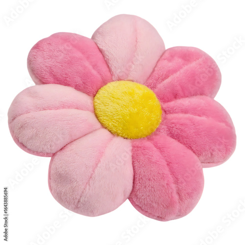 A soft pink plush flower pillow with a yellow center is isolated on a transparent background offering a cozy and decorative touch