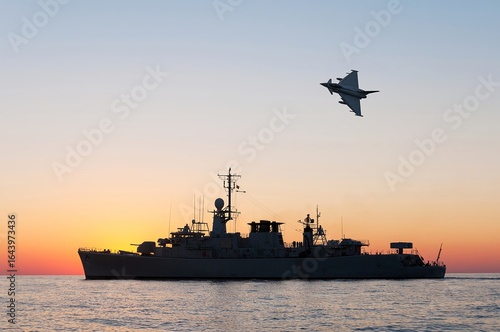 A military plane flies over a warship during a peacekeeping operation in the Black Sea.
