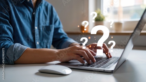 Seeking answers online with laptop and floating question marks for modern business solutions