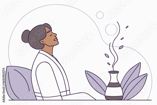 Calm client breathes deeply during an aromatherapy session with essential oils diffused nearby.
