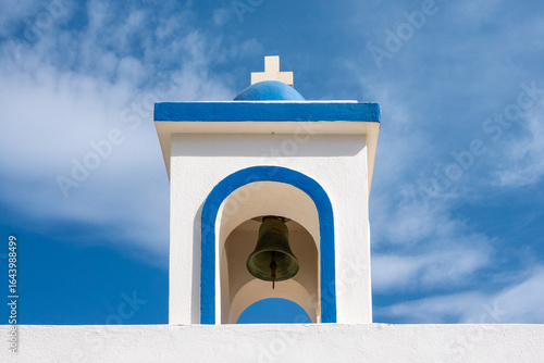 Traditional Mediterranean Bell Tower Under Blue Sky