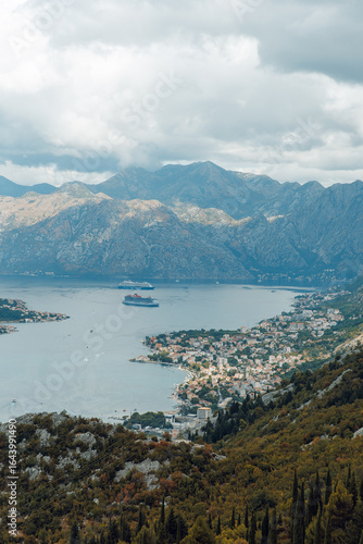 view on a lake from the mountains close to the clouds