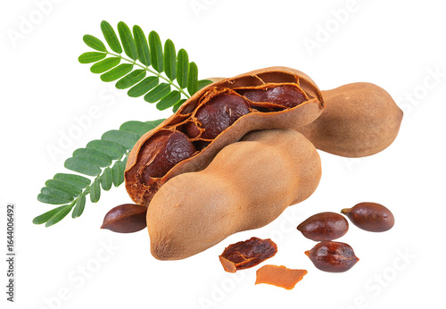 Fresh tamarind pods with green leaves and seeds on isolated white background tropical fruit photo