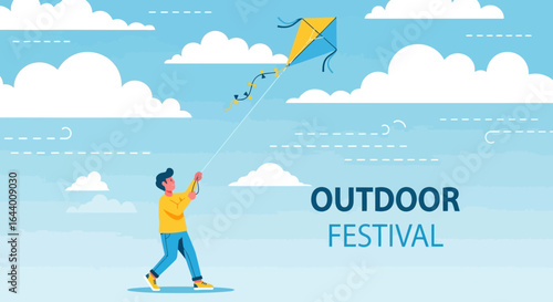 Boy flying a kite against a blue sky with fluffy clouds for outdoor festival concept
