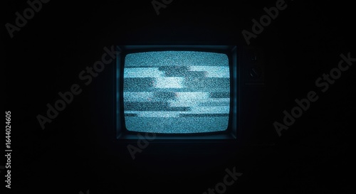 Vintage Television Glowing with Hypnotic Blue Static in Pitch Darkness
