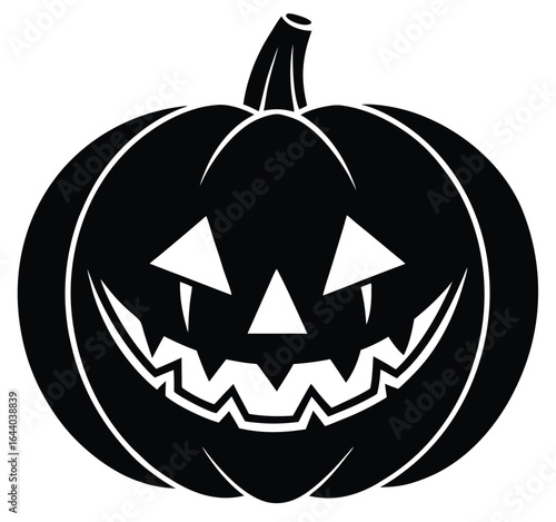 Spooky jack o lantern with a scary evil smile is isolated on a dark background for Halloween