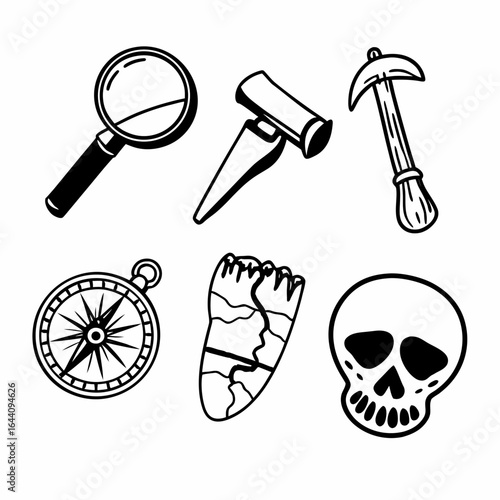 Archaeological tools and finds including a magnifying glass isolated on white background