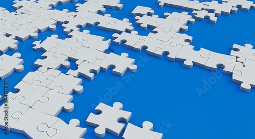 Scattered White Puzzle Pieces Awaiting Connection on a Vibrant Blue Background