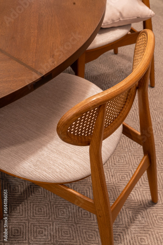 Wooden chair with handmade fabric in front of a round table