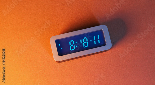 top view of classic alarm clock on peach background